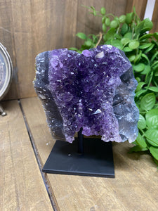 Amethyst Crystal on black display stand
