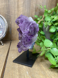 Amethyst Crystal on black display stand