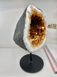Large Citrine cave on black stand