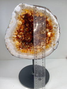 Large Citrine cave on black stand