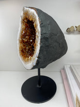 Load image into Gallery viewer, Large Citrine cave on black stand