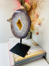 Load image into Gallery viewer, Large Natural Agate Geode with Quartz crystals inside on black stand