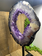 Load image into Gallery viewer, Amethyst Crystal geode slice on black display stand