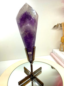 Phantom Amethyst point on display stand