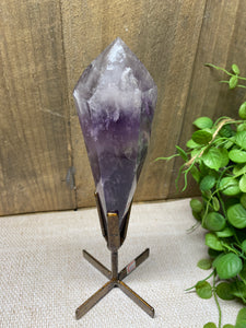 Phantom Amethyst point on display stand