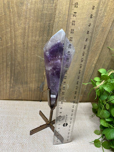 Phantom Amethyst point on display stand