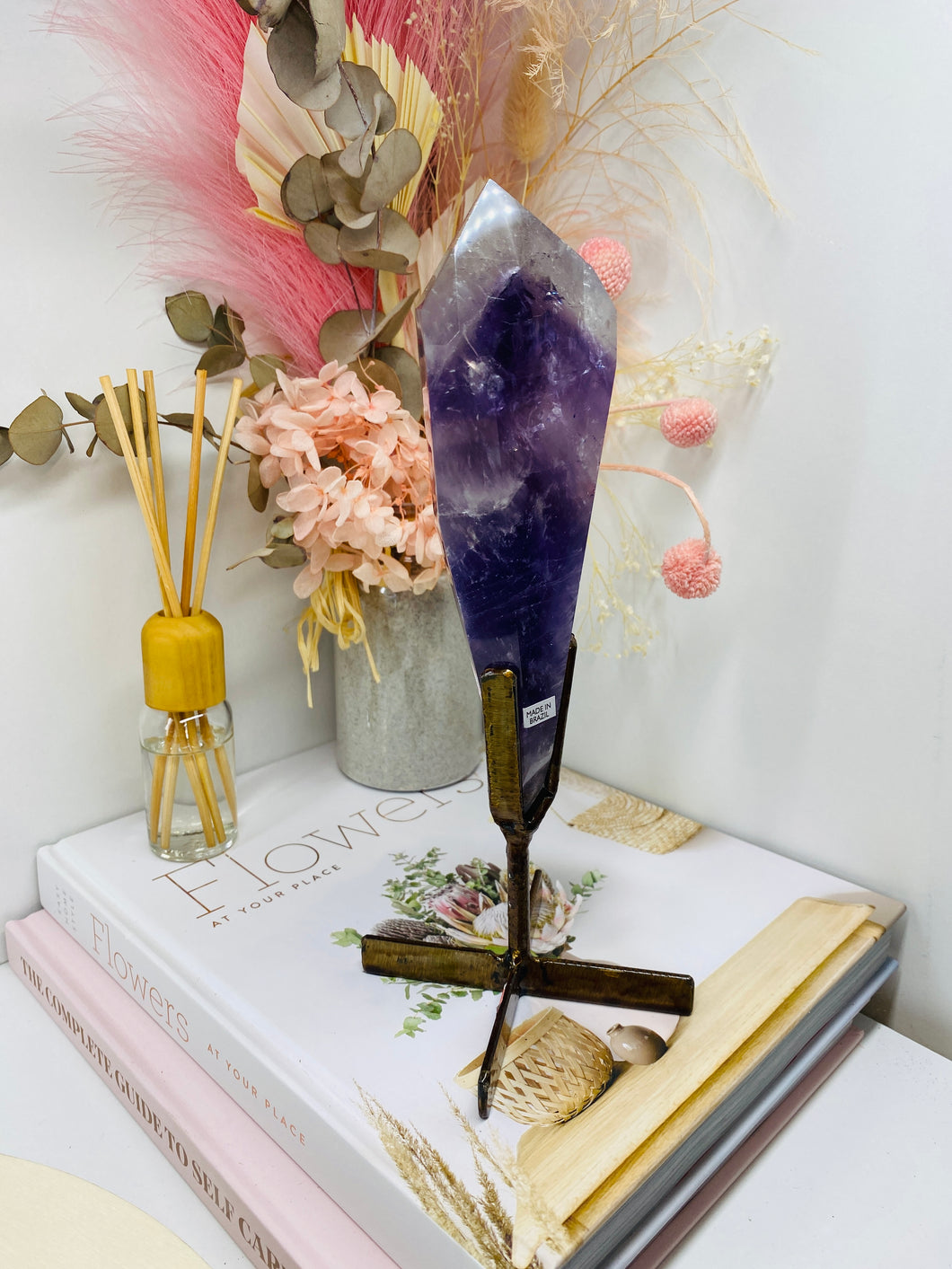 Phantom Amethyst point on display stand