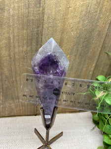 Phantom Amethyst point on display stand