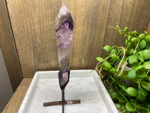 Phantom Amethyst point on display stand