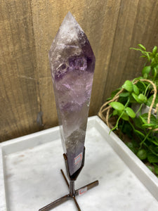 Phantom Amethyst point on display stand