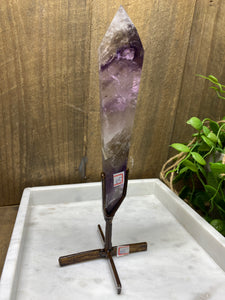 Phantom Amethyst point on display stand