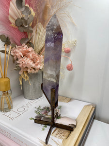 Phantom Amethyst point on display stand