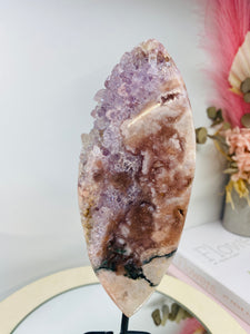 Pink Amethyst Crystal on black display stand