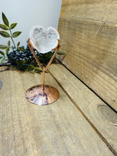 Load image into Gallery viewer, Polished Clear Quartz love heart on rose colored metal stand with zodiac sign