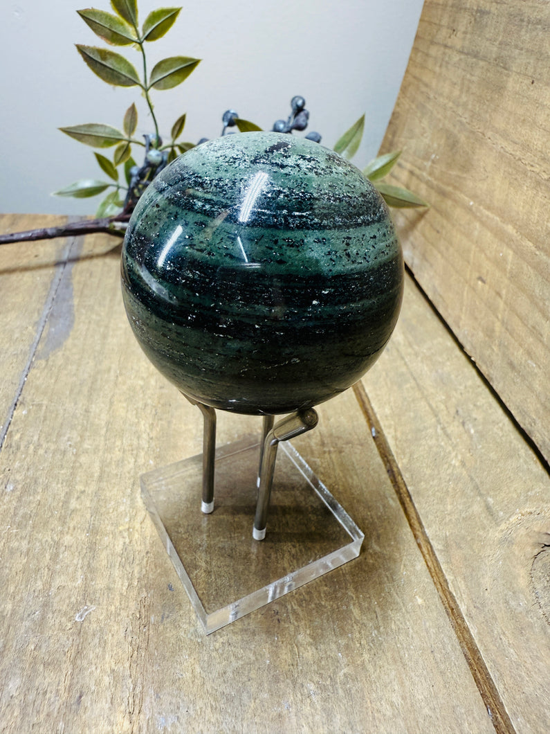 Polished Green Hair Jasper sphere on stand