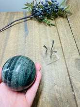 Load image into Gallery viewer, Polished Green Hair Jasper sphere on stand