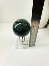 Load image into Gallery viewer, Polished Green Hair Jasper sphere on stand