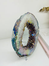 Load image into Gallery viewer, Titanian coated Amethyst Crystal geode slice on display stand