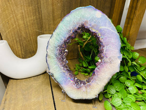 Titanian coated Amethyst Crystal geode slice on display stand