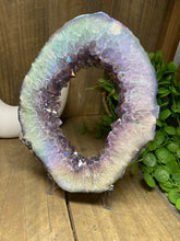 Load image into Gallery viewer, Titanian coated Amethyst Crystal geode slice on display stand