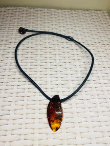 Amber pendant on leather - necklace