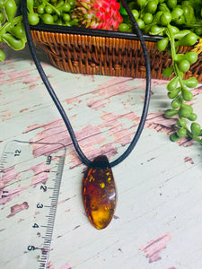 Amber pendant on leather - necklace
