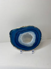 Load image into Gallery viewer, Blue polished Agate Slice drink coaster with silver electroplating around the edges 