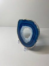 Load image into Gallery viewer, Blue polished Agate Slice drink coaster with silver electroplating around the edges 