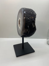 Load image into Gallery viewer, Large Natural Agate Geode with Quartz crystals inside on black stand