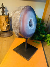 Load image into Gallery viewer, Large Natural Agate Geode with Quartz crystals inside on black stand