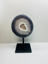 Load image into Gallery viewer, Large Natural Agate Geode with Quartz crystals inside on black stand