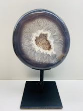 Load image into Gallery viewer, Large Natural Agate Geode with Quartz crystals inside on black stand