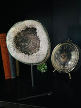 Load image into Gallery viewer, Large Natural Agate Geode with Quartz crystals inside on black stand