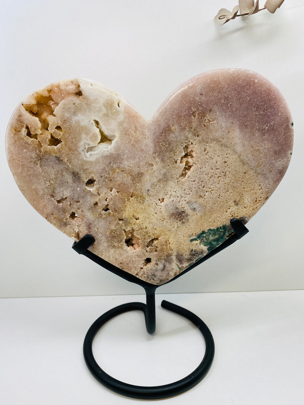 Pink Amethyst Crystal heart on black display stand