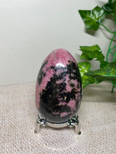 Load image into Gallery viewer, Rhodonite egg display piece - office decor or unique home display piece