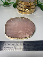 Load image into Gallery viewer, Rose Quartz slice drink coasters with gold electroplating around the edges
