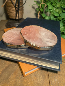Rose Quartz slice drink coasters with gold electroplating around the edges