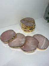 Load image into Gallery viewer, Rose Quartz slice drink coasters with gold electroplating around the edges