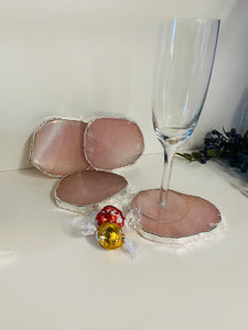 Rose Quartz slice drink coasters with silver electroplating around the edges